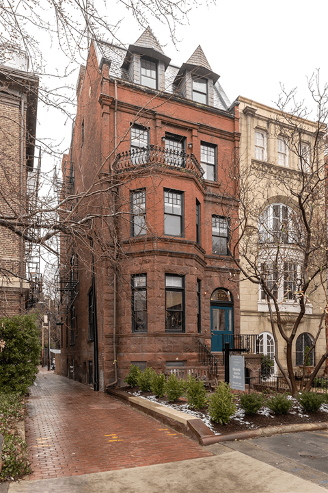 a red brick building on a city street